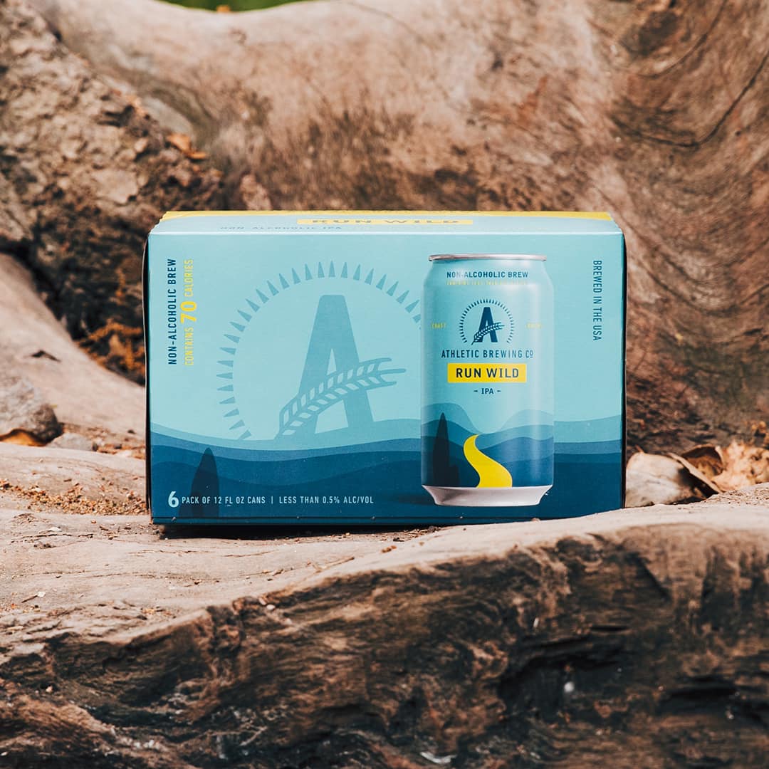 athletic brewing co. run wild ipa on rock formation outdoors